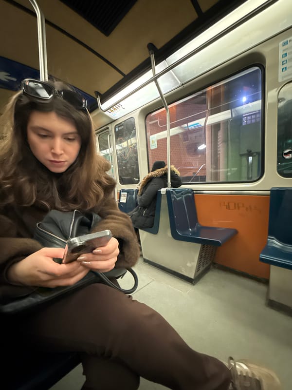 Evening commuters use phones, shop vintage items in Montreal