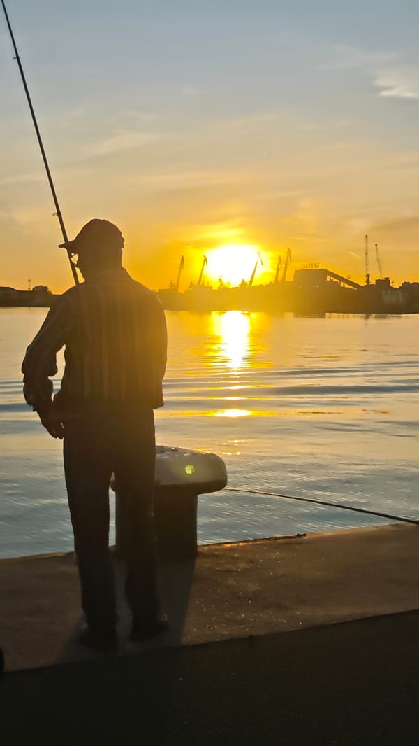 Evening fishing scene captured at Burgas harbor during sunset