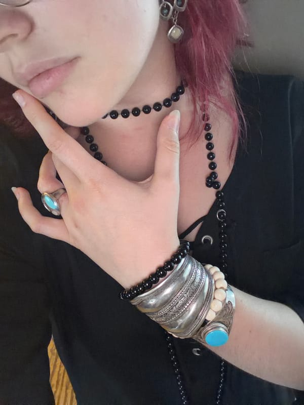 Stacked silver jewelry and bold accessories in Chelyabinsk