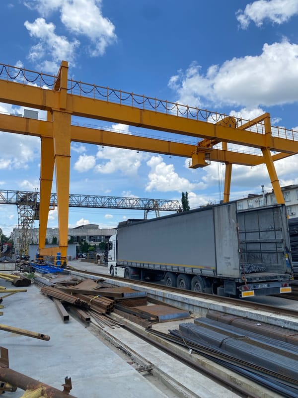 Yellow gantry cranes at a Chișinău industrial yard