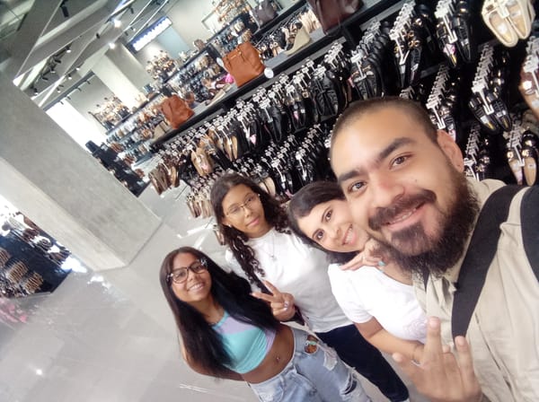 Evening shoppers browse handbags at Venezuelan retail store