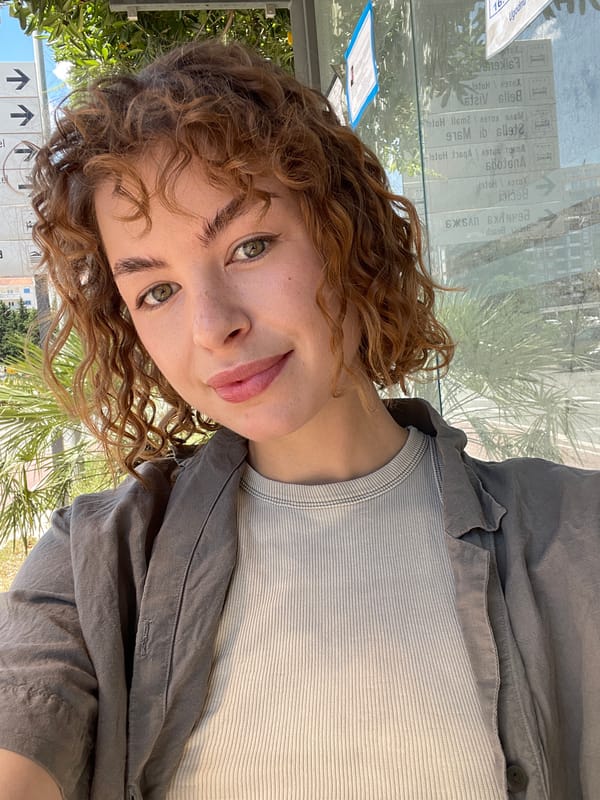 Woman takes selfies on bench in Rafailovići Montenegro