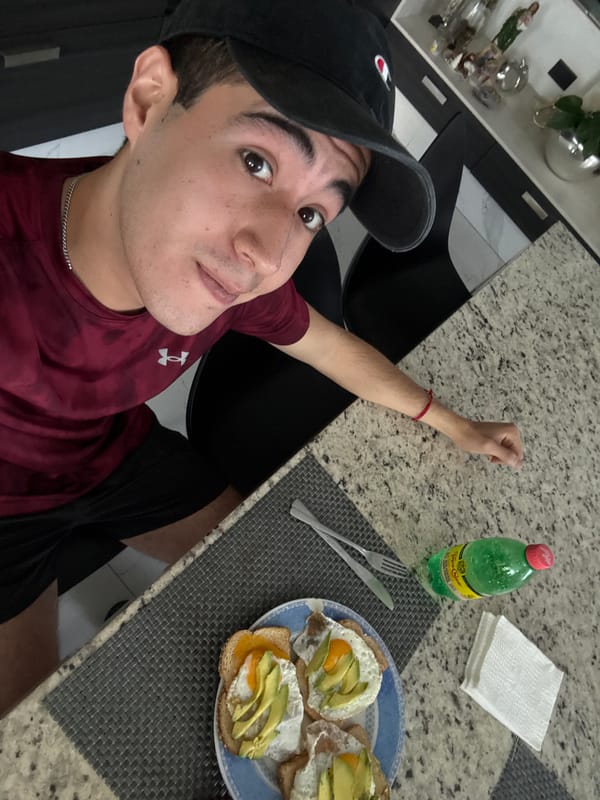Young man takes selfie with breakfast in Mexico