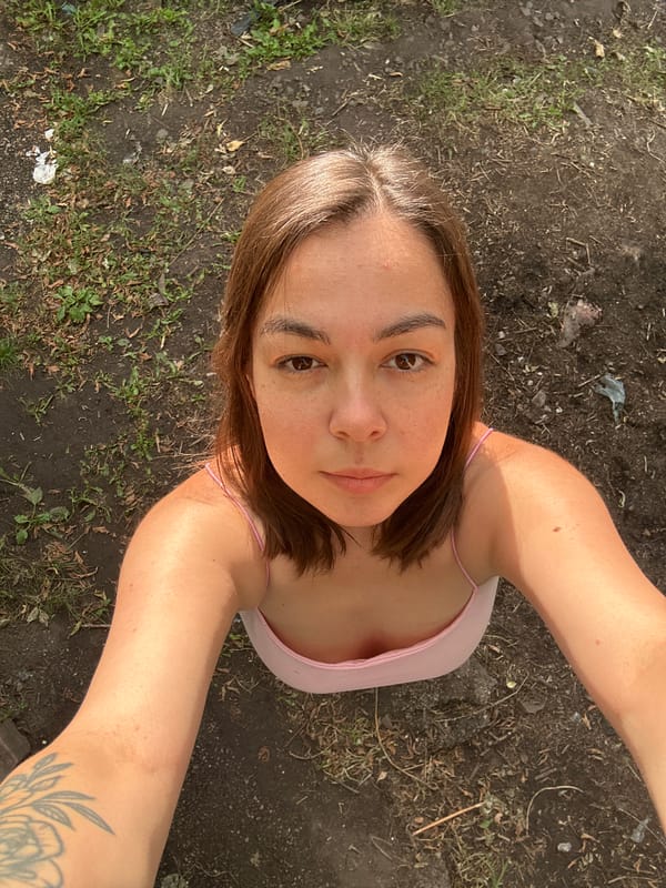 Backyard afternoon in Magnitogorsk: dogs, birch trees, and rustic surroundings