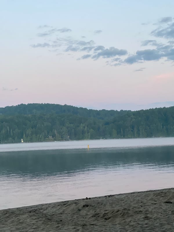 Misty dawn over a calm lake near Duhamel, Canada
