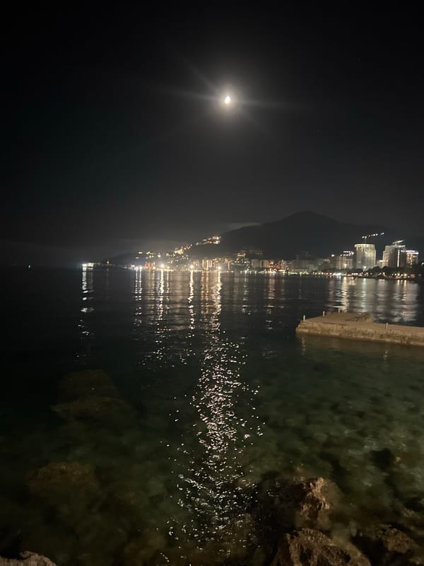 Full moon illuminates Boreti, Montenegro skyline at night
