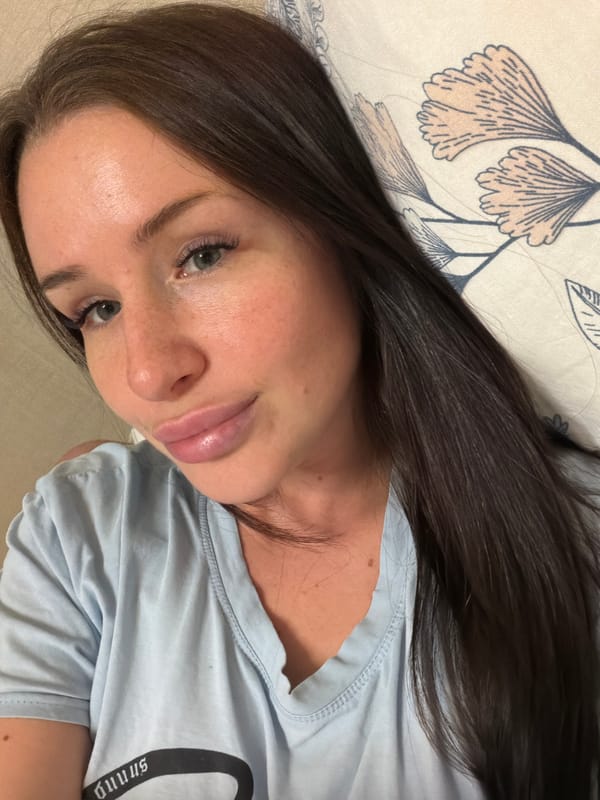 Woman photographs herself during indoor session in Saint Petersburg
