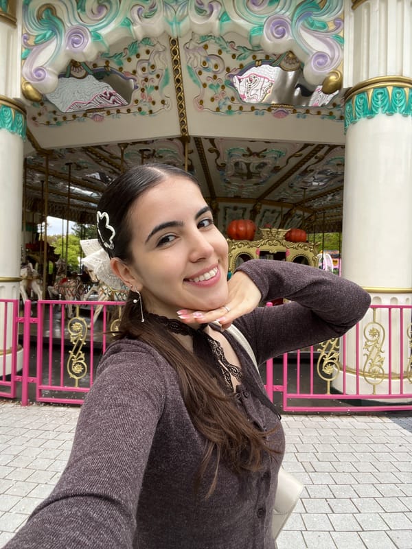 Woman poses with cartoon egg statue in Daegu