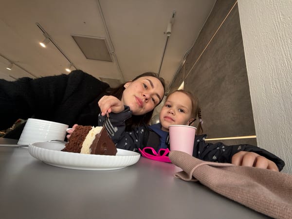 Mother and daughter share cake at Chaikovsky cafe