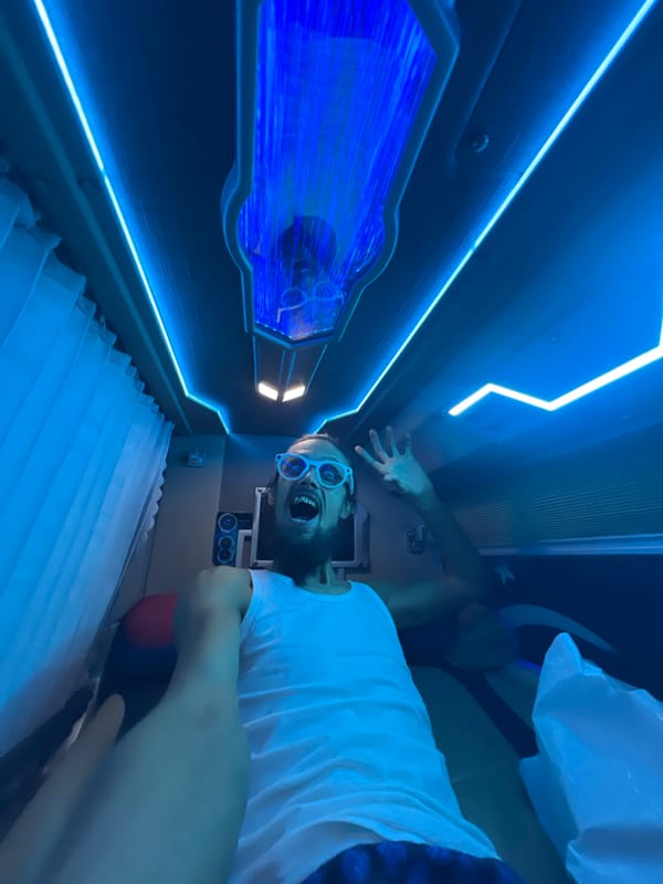 Selfie clips inside a neon-lit capsule pod