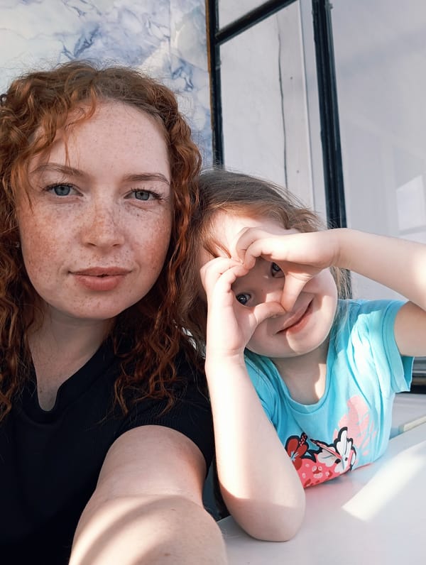 Red-haired woman photographed in portrait session in rural Russia