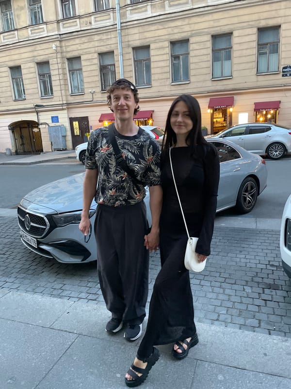 Tourists explore Saint Petersburg landmarks during summer evening hours