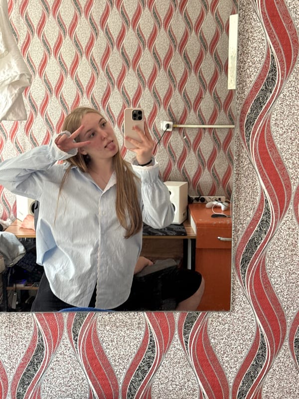 Young woman takes playful selfies, dances in Perm apartment