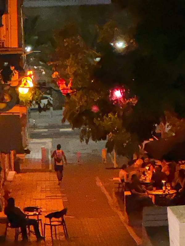 Nighttime alleyway scene in Haifa, Israel