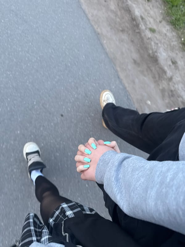 Couple holds hands walking together in Saint Petersburg