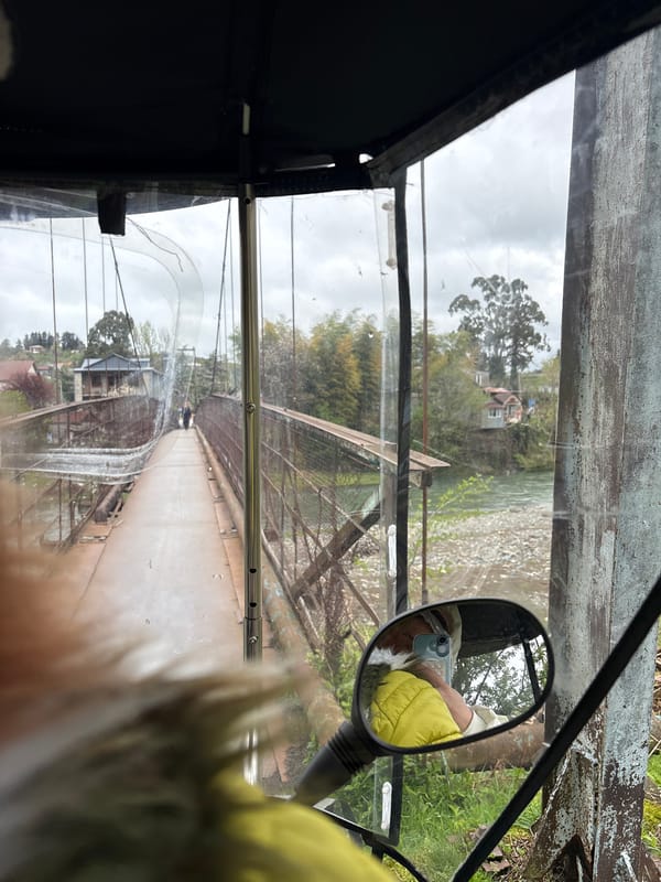 Vehicle crosses river bridge in Chakvi, Georgia