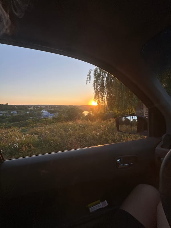 Sunset over rural Makiv, Ukraine, from a moving car