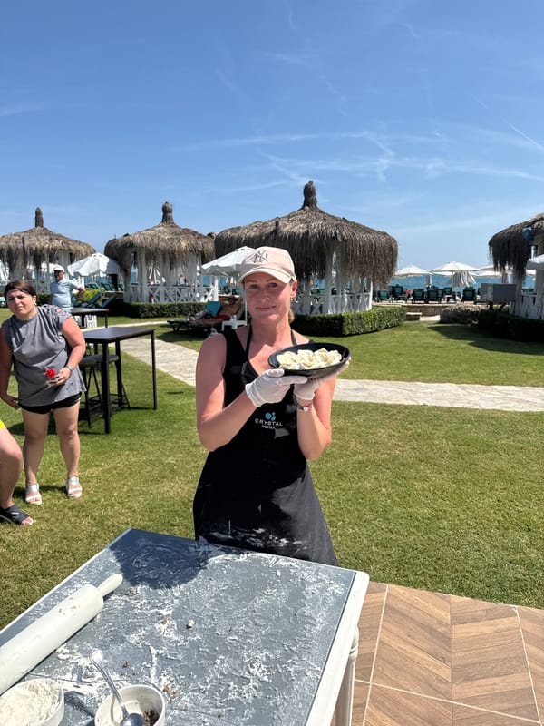 Woman displays gold medal at Turkish resort in Serik