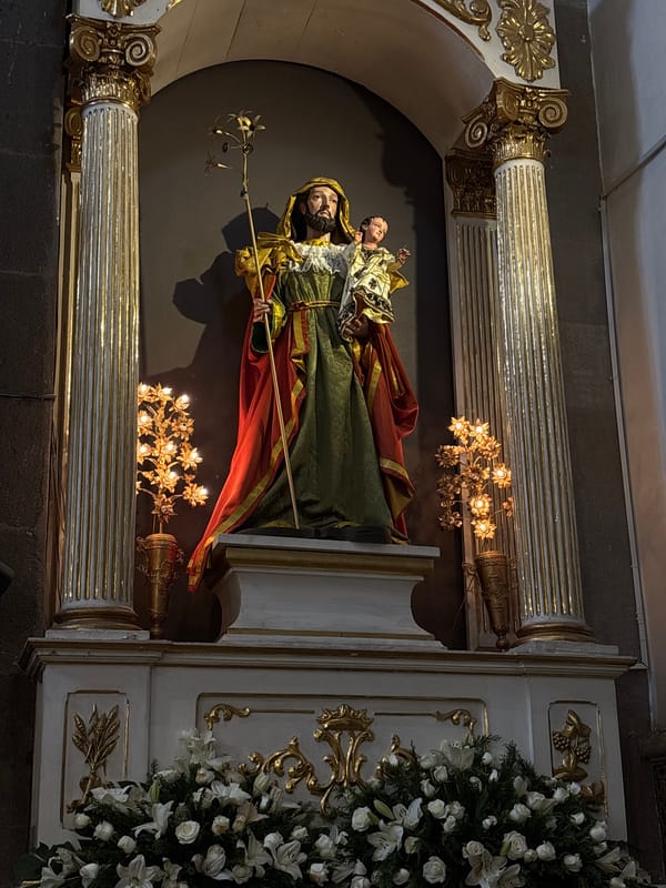 Visitor documents ornate historic church interior in Puebla, Mexico