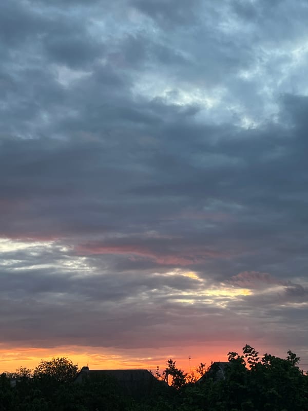 Dawn sky observed over Slobozia rooftops
