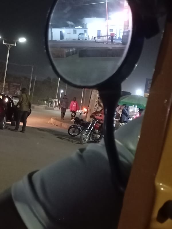 Evening street life and smartphone use documented in Jos