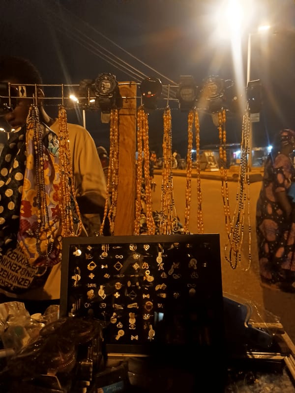 Night market vendors sell goods on Bukuru streets