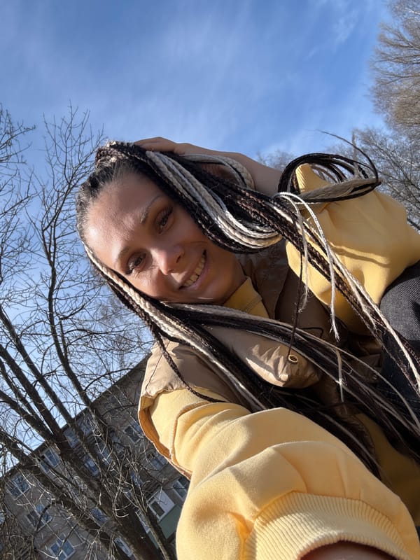 Woman with braids photographed outdoors in Rusanovo, Russia