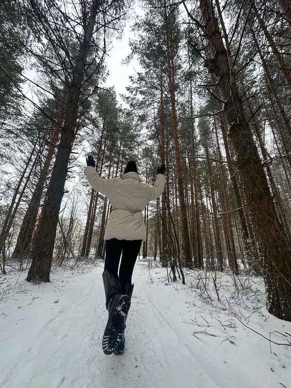 Woman photographed during snowfall in Chaikovsky, Russia