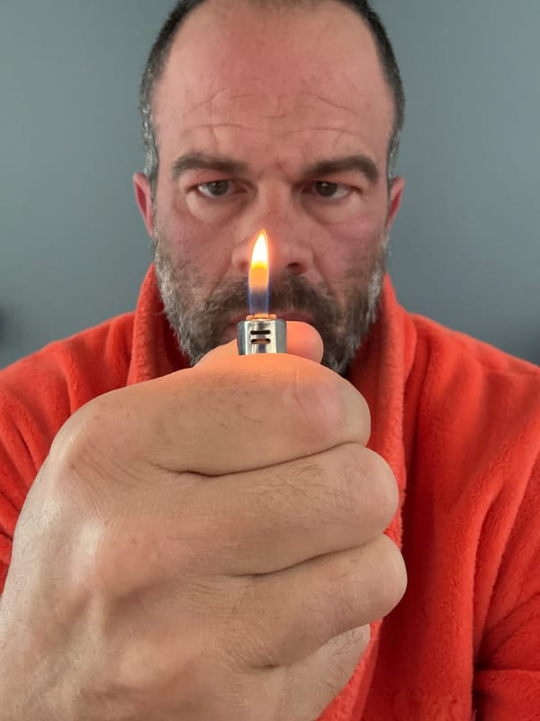 Man operates lighter indoors in Marche-en-Famenne, Belgium
