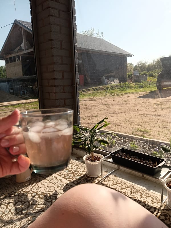 Woman photographed with iced drink in rural Russian village