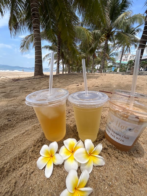 Beach drinks and flowers arranged on Nha Trang sand