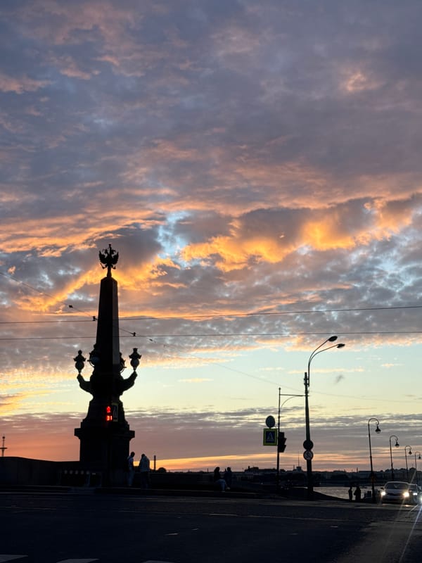 Eagle monument silhouetted at sunset on a Saint Petersburg bridge