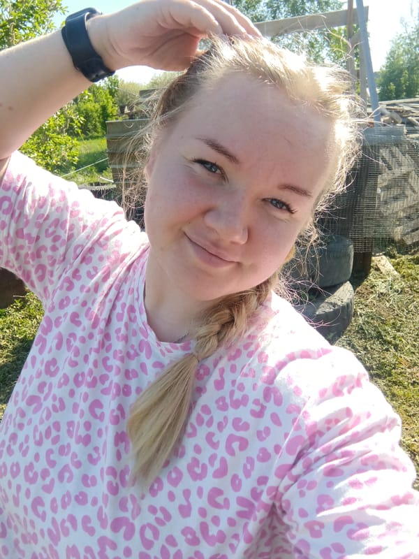 Woman takes outdoor selfie in leopard-print shirt