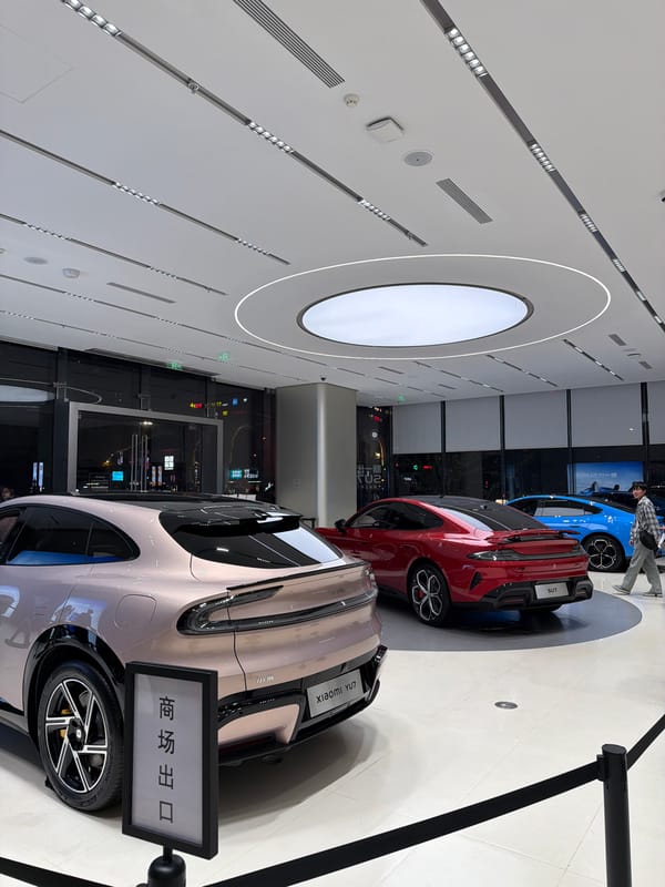 Customers browse Xiaomi electric cars at Jiangning showroom