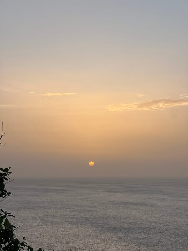 Sun sets and moon rises over San Juan del Sur