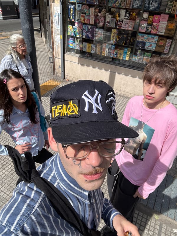 Group poses for photo on Buenos Aires shopping street