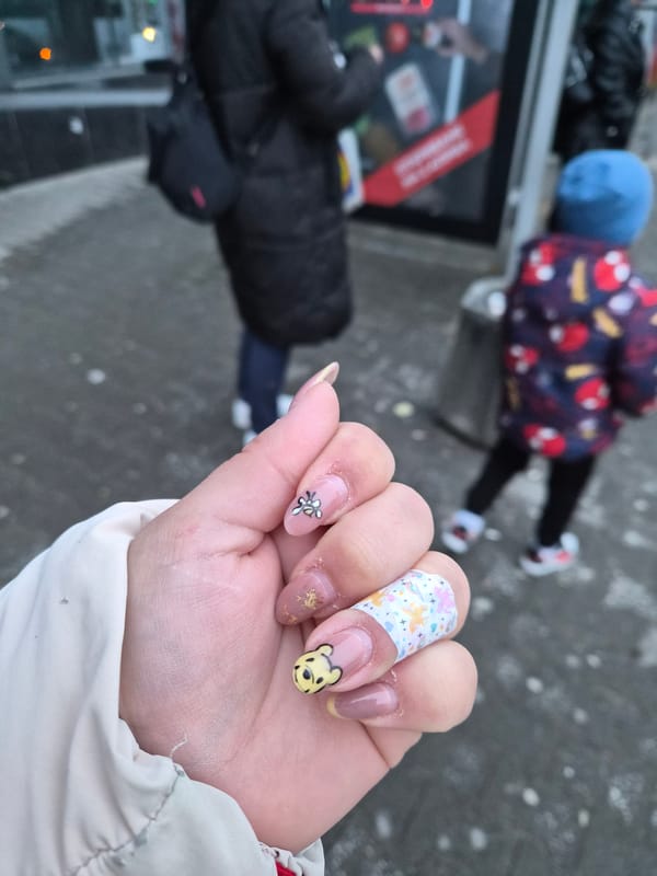 Decorated nail art featuring Winnie the Pooh displayed in Plovdiv