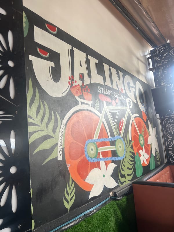 Inside a Nigerian venue: murals, stage setup, and daytime lounging