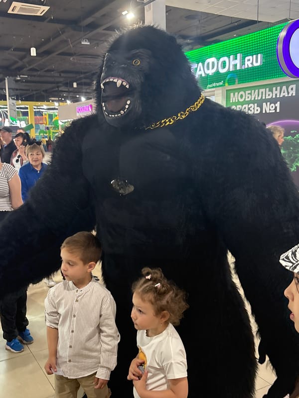 Children pose with animatronic gorilla in Astrakhan, Russia