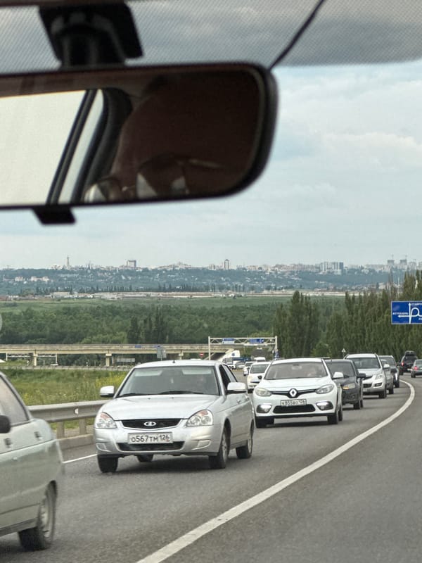 Highway traffic jam outside Mikhaylovsk amid open farmland