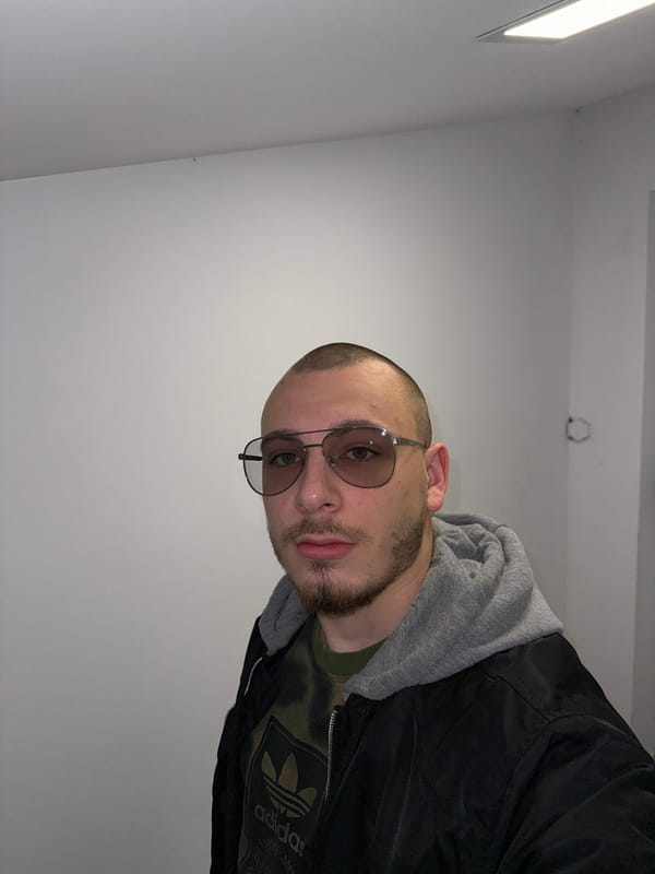Man in Adidas jacket photographed indoors in Bulgaria