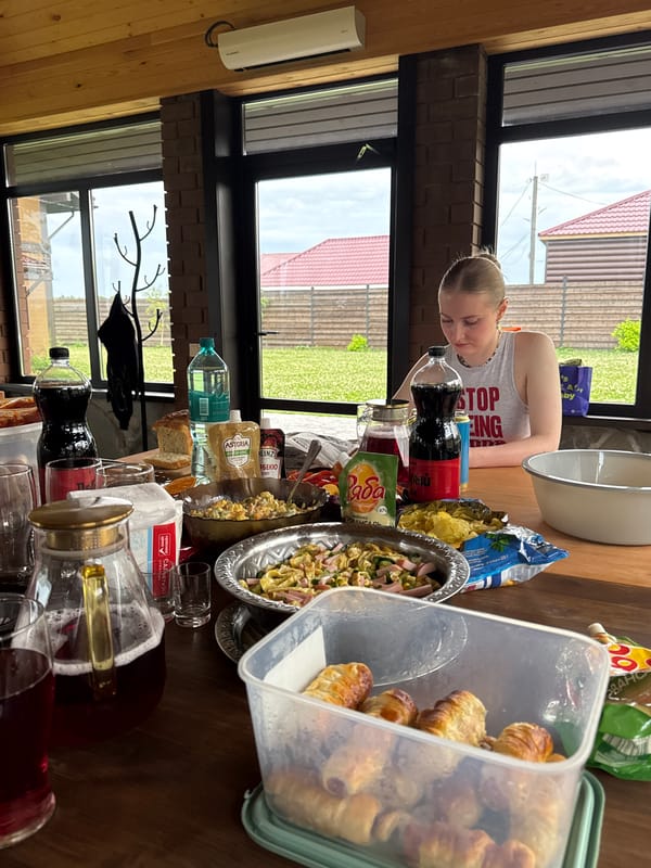 Casual summer hangout with food and a fireplace in rural Russia