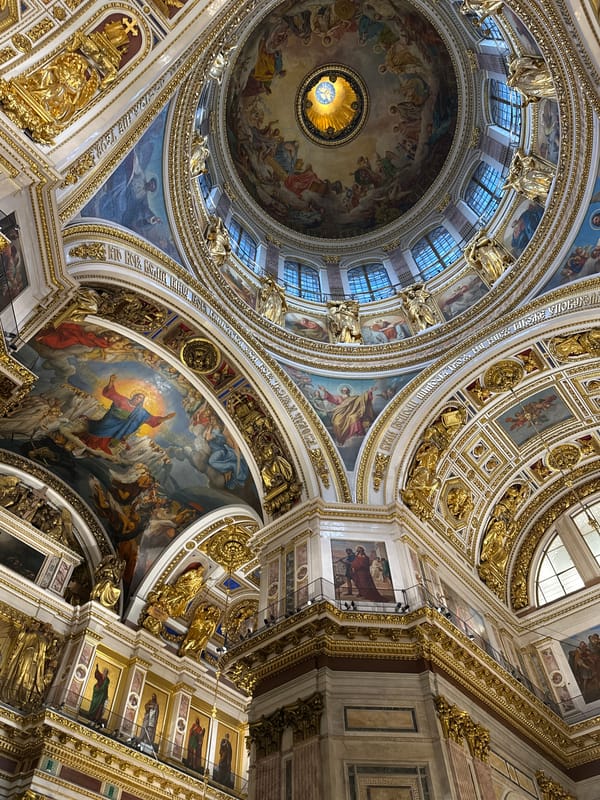 Tourists photograph ornate interior of Saint Isaac's Cathedral