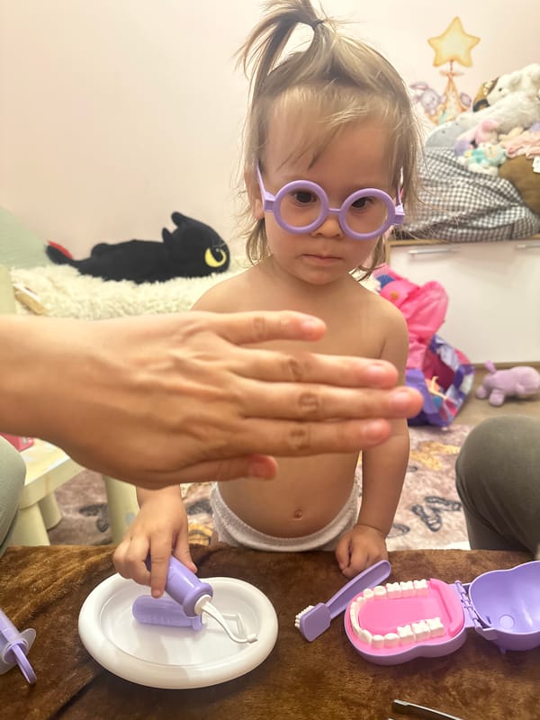 Child plays with toy dentist set in Kharnavy, Russia