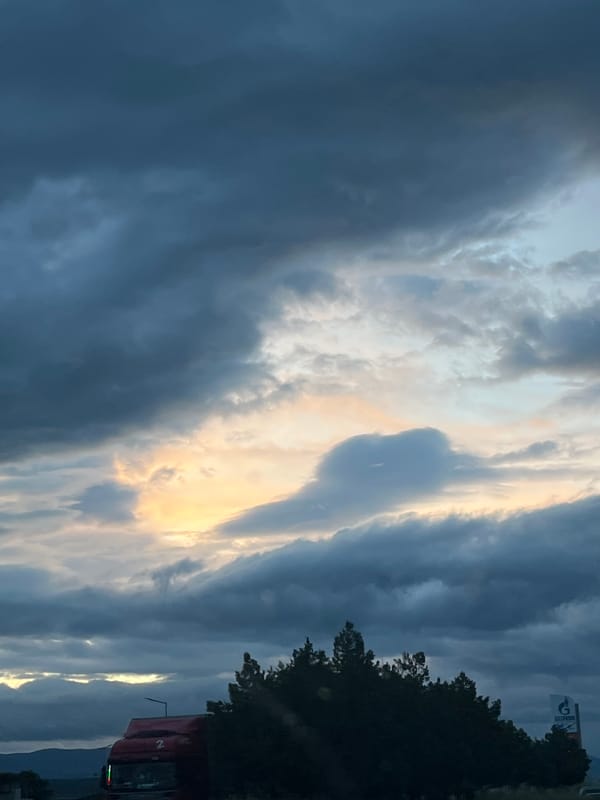 Golden light breaks through dramatic clouds over Blagoevgrad, Bulgaria