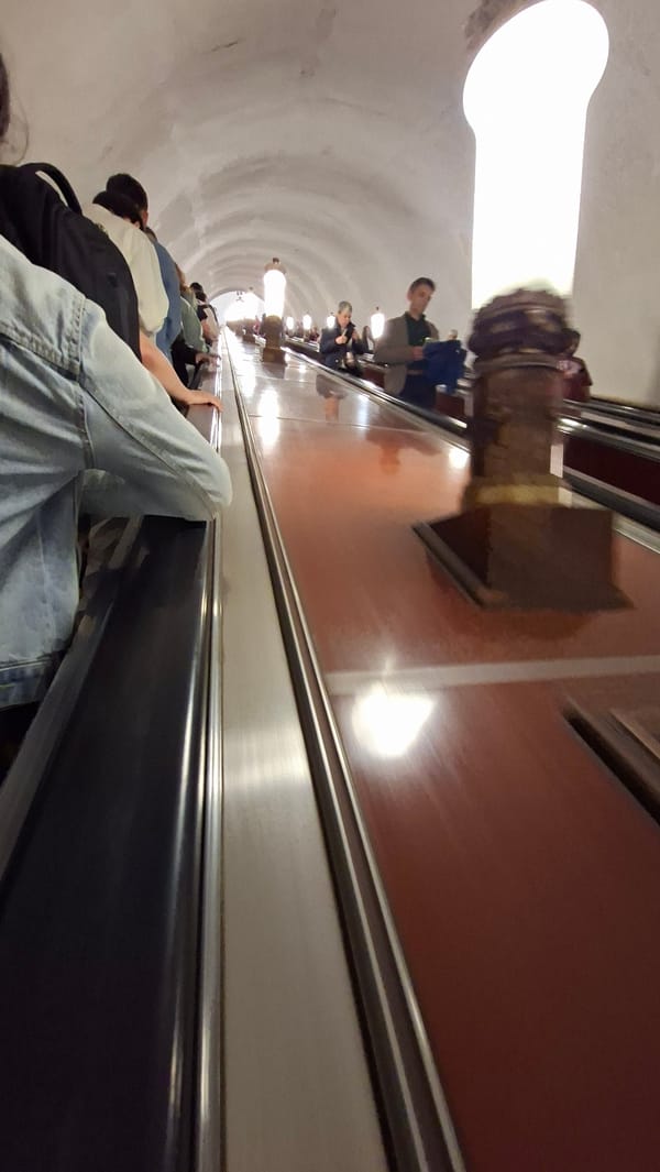 Riding the escalators deep into the Moscow Metro