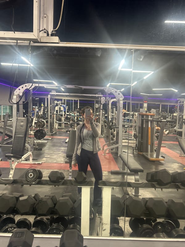 Woman takes gym selfie during early morning workout session