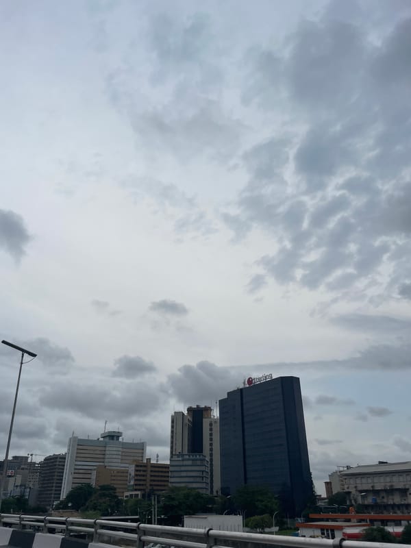 Lagos cityscape photographed showing Sterling building under cloudy skies