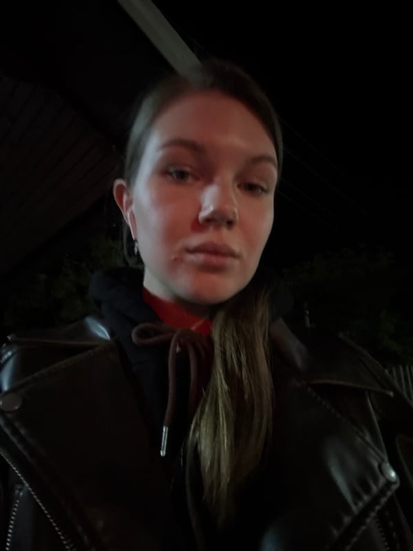 Nighttime selfie captured at Serbian border crossing near EXPO signs