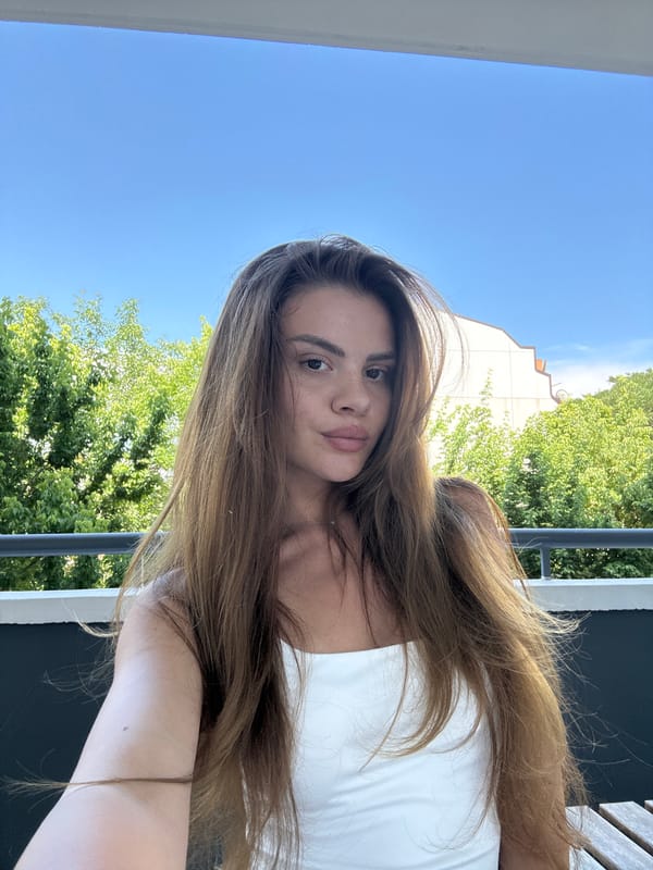 Woman Takes Extended Selfie Session on Plovdiv Balcony